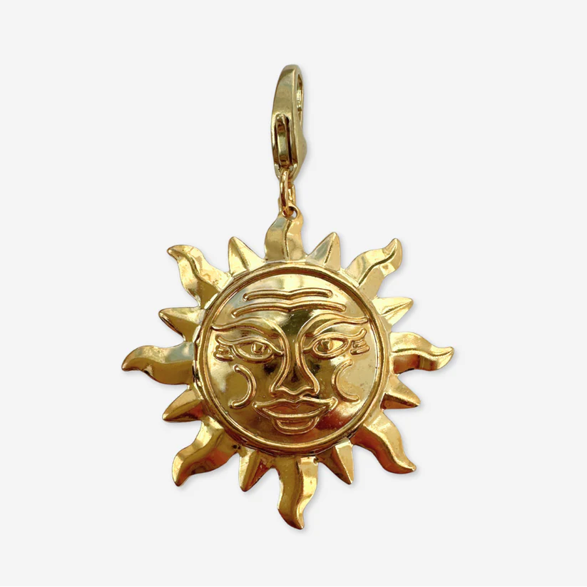 Vintage gold plated stamped sun charm
